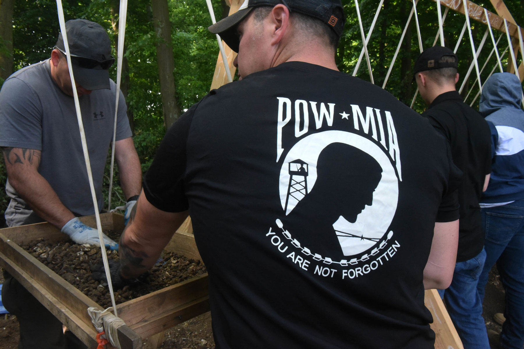 U.S. Army Sgt. 1st Class Nathan Fair, with the Defense POW/MIA Accounting Agency (DPAA) dry screens soil in search of remains in Boussicourt, France, May 22, 2018. (U.S. Army photo by Staff Sgt. Richard DeWitt)