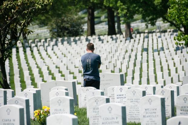 A man standing at Arlington National Cemetery.