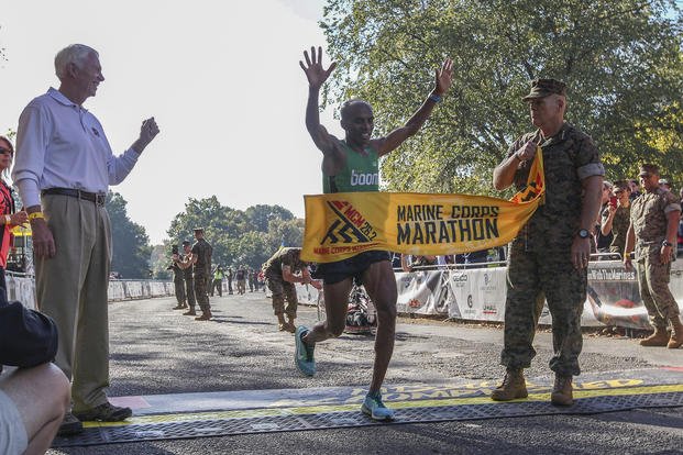 First male finisher crosses finish line at 2017 Marine Corps Marathon.