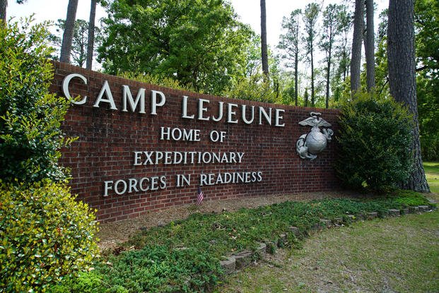 Signage stands on the main gate to Camp Lejeune Marine Base