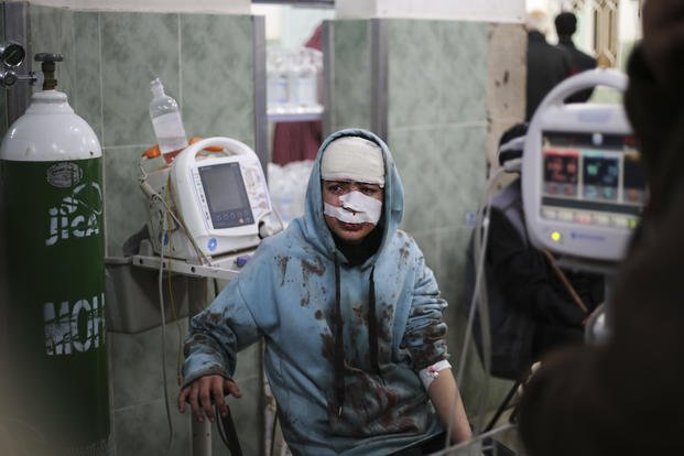 A Palestinian wounded in the Israeli bombardment sits in a hospital In Rafah, Gaza Strip.