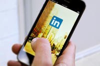 Person viewing LinkedIn on a mobile phone (Photo: LinkedIn)