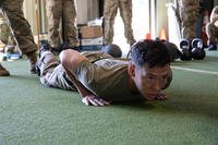 A soldier performs a hand-release push-up during the Army combat fitness test.