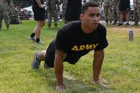 A soldier completes a hand-release push-up during the Army combat fitness test.