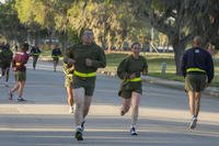 Marine recruits perform the three-mile run portion of the physical fitness test.
