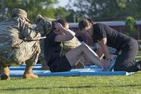 A reservist does sit-ups to pass the Army physical fitness test.