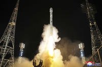 North Korean government shows what it says is the launch of a military spy satellite into orbit.