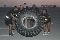 From left, Sergeant 1st Class Tyrone Griffin, Brig. Gen. Kenneth Hubbard, Col. Cody Zilhaver, Sgt. Maj. Herlitz Henderson and Lt. Col. Leah Jones participate in a team-building fitness competition as part of the Financial Management and Comptroller Forum in Qatar.