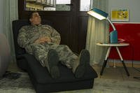 U.S. Air Force Col. Steven Zubowicz, 52nd Mission Support Group commander, tests out a Bright Light Therapy box during a tour of the dormitories at Spangdahlem Air Base, Germany.