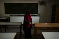 Nabela, who was detained by Israeli forces, poses for a portrait at a U.N. school.
