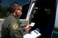 Border Patrol agent reads the Miranda rights to a Mexican national arrested for transporting drugs. (U.S. Dept. of Homeland Security photo)